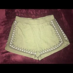 Green shorts with design on the outer lining